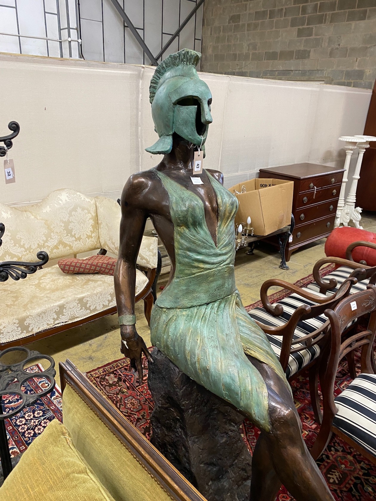 A bronzed resin sculpture of a female Greek warrior, height 174cm